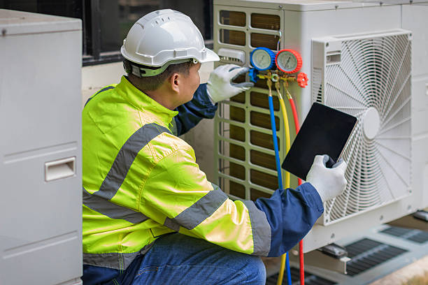 Professional Air Duct Cleaning technician working in University Park, IL